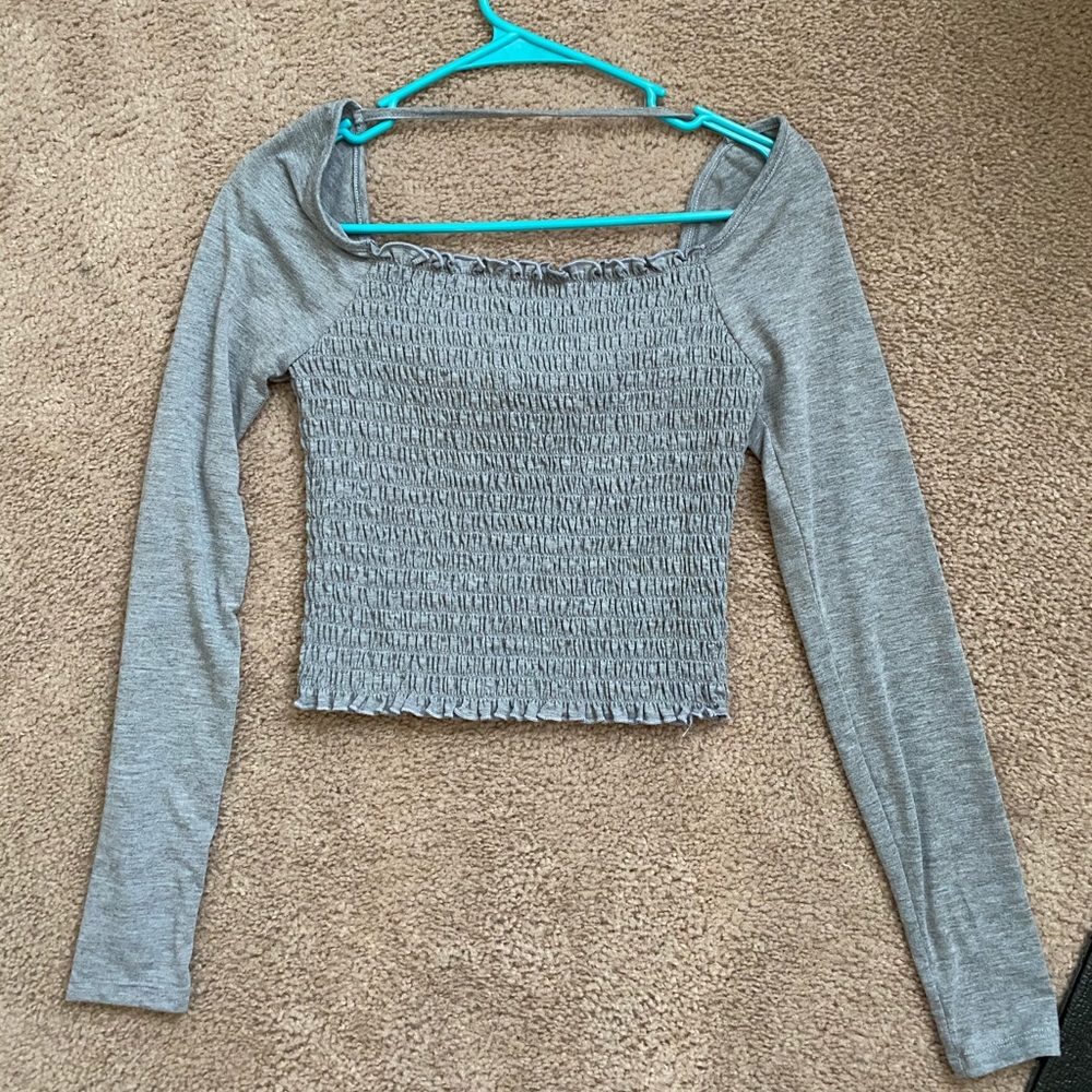 tight, cinched grey shirt